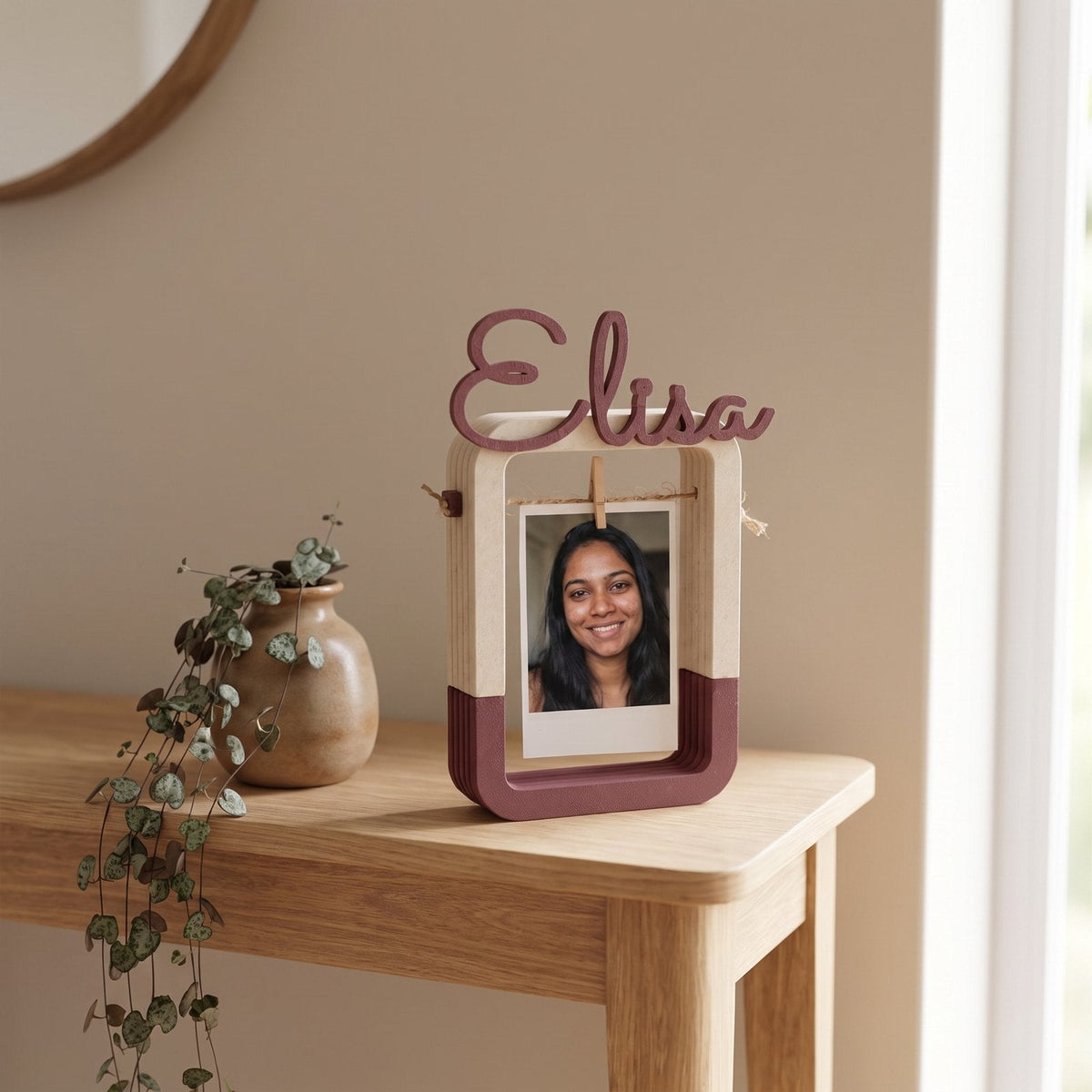 Personalised hanging photo frame with a name shaped across the top