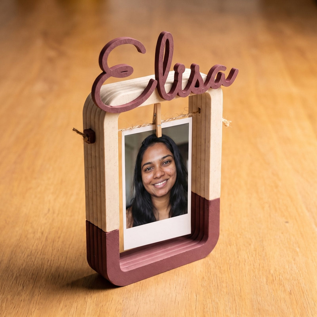 Personalised hanging photo frame with a name shaped across the top