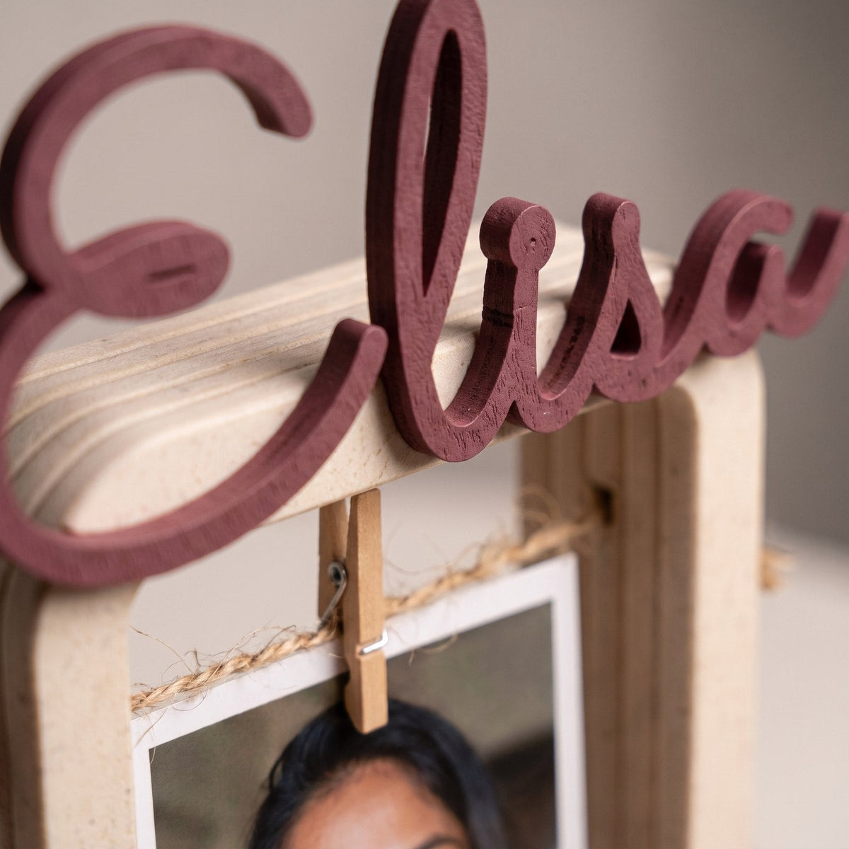 Personalised hanging photo frame with a name shaped across the top