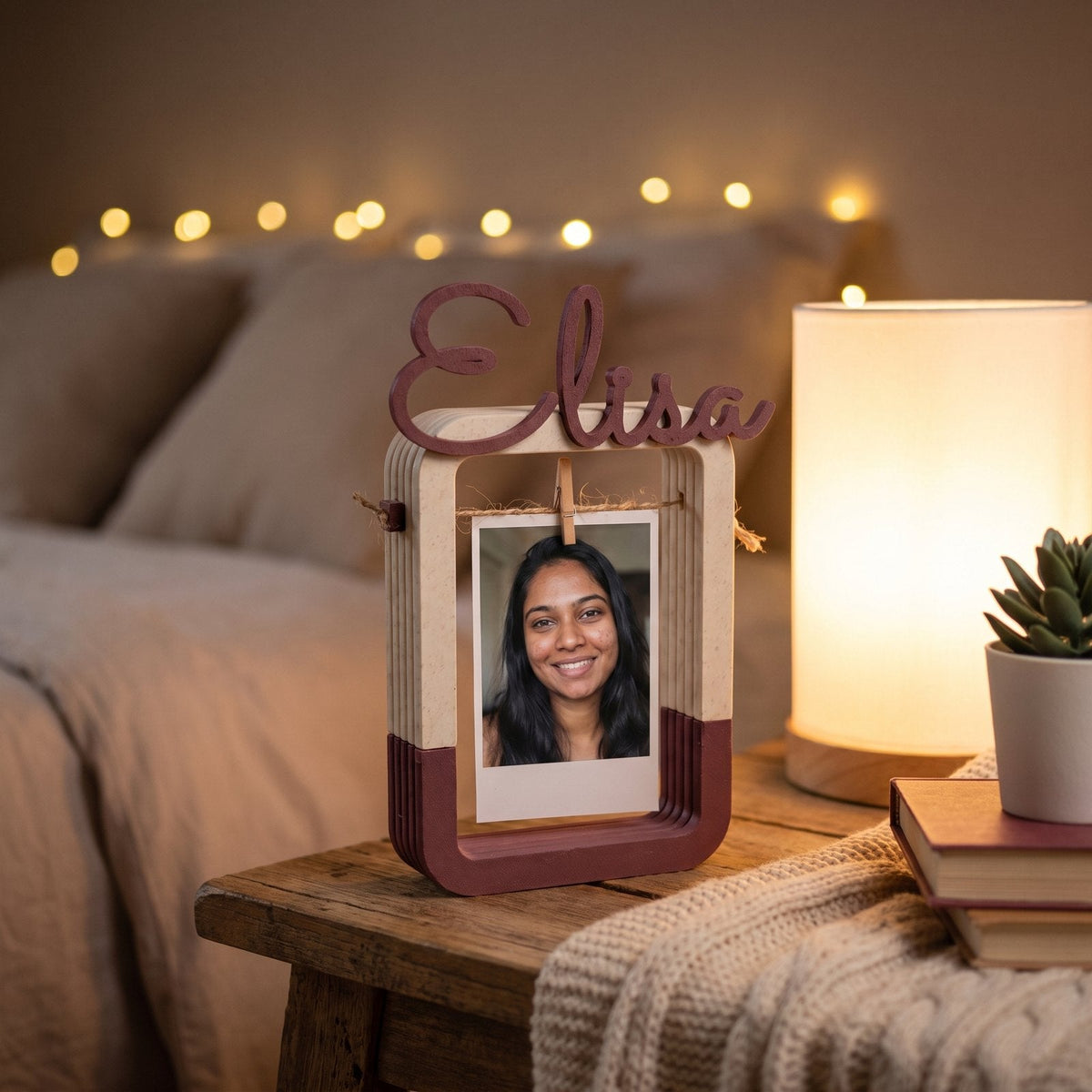 Personalised hanging photo frame with a name shaped across the top